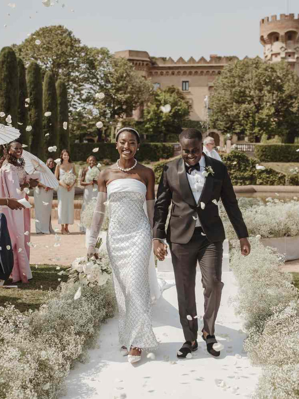 Ceremony recessional petal toss at Castell Sant Marçal — Agape Weddings