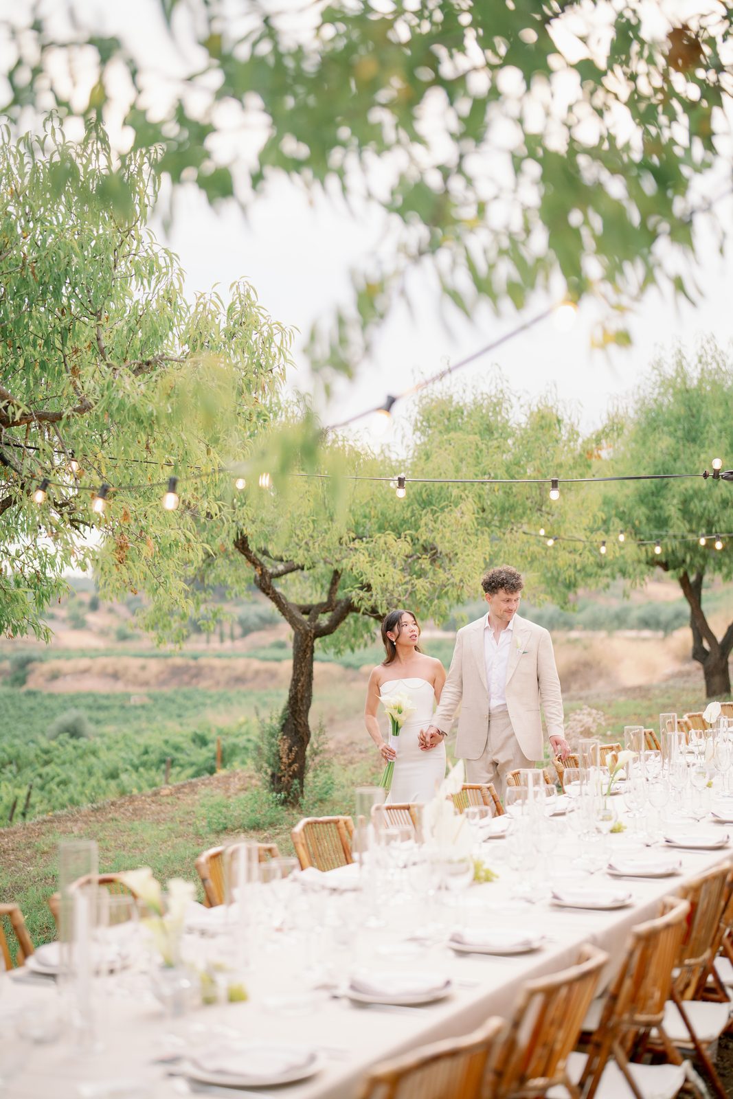 Janice & Finn — couple walking past the long table