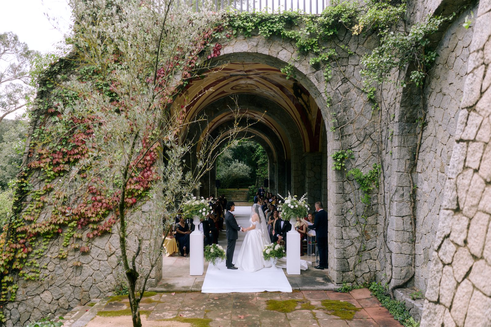 Mina & Bilal — vow exchange beneath frescoed arches