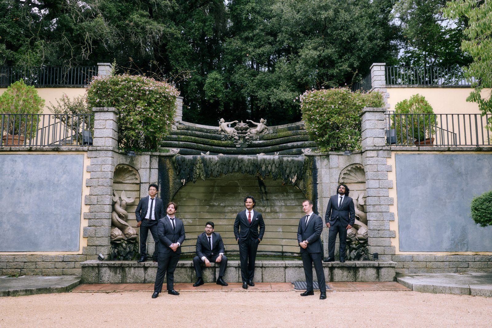 Groomsmen at the baroque fountain