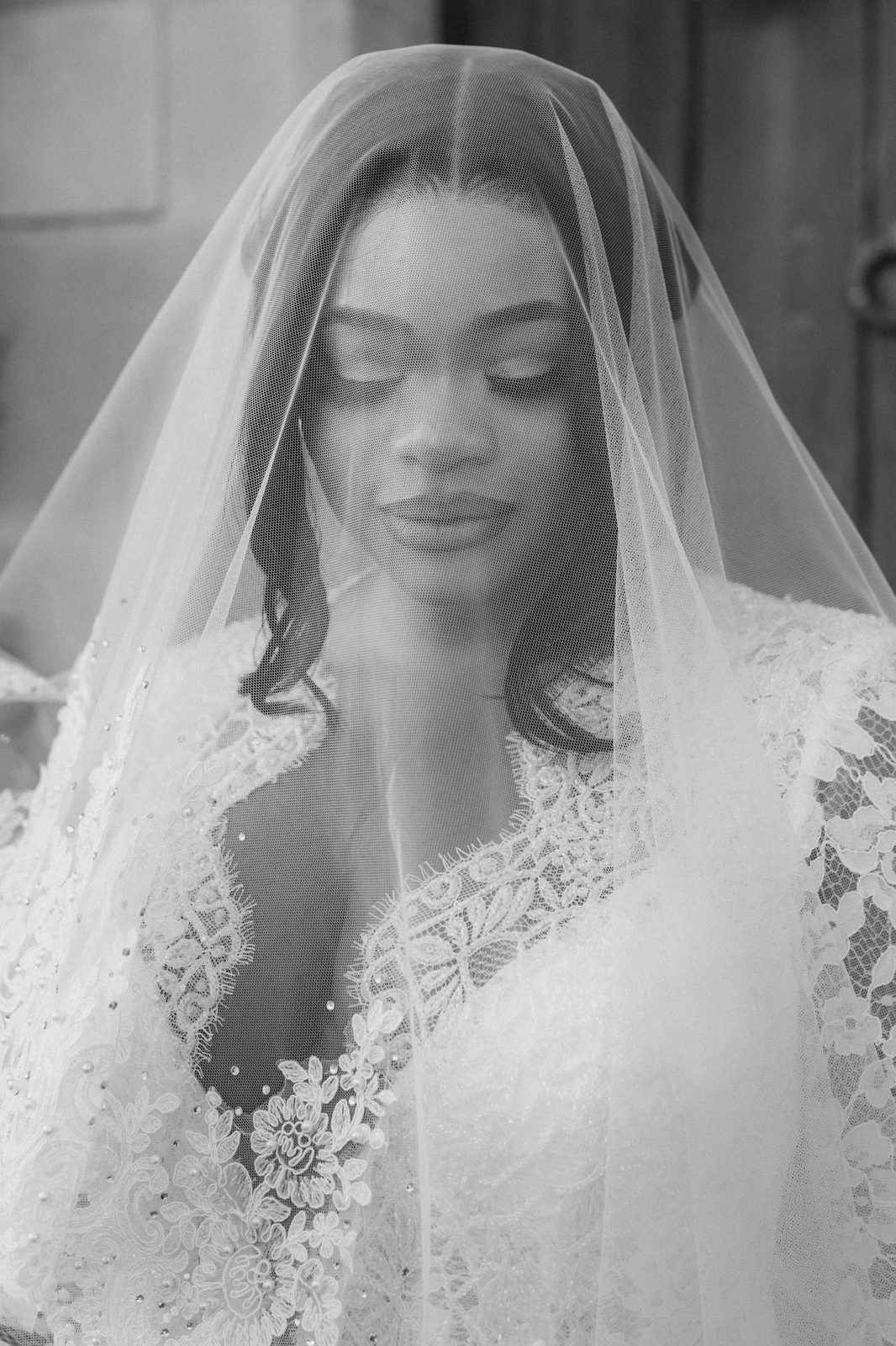 Peju — bride with lace veil, black and white close-up