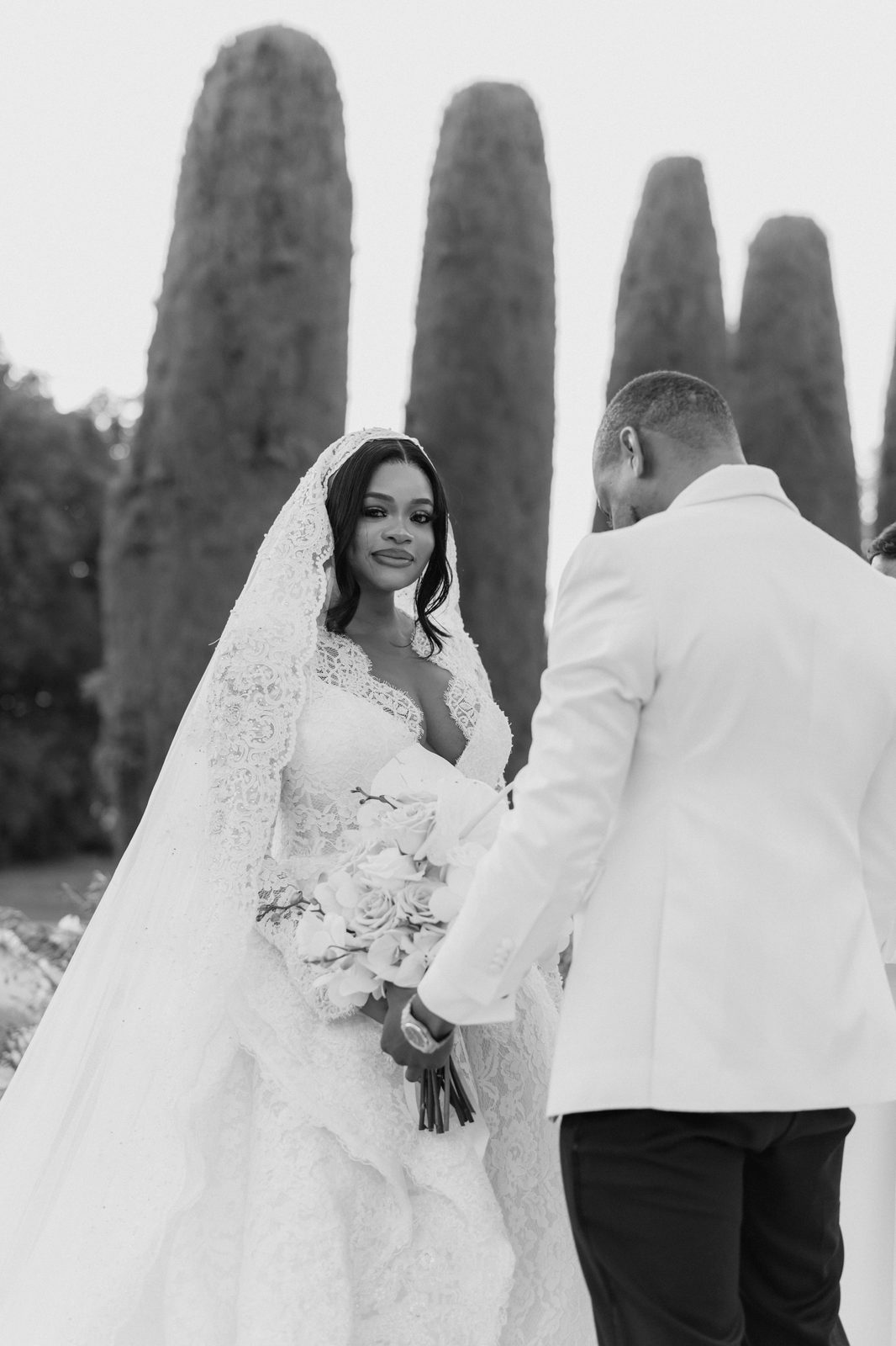 Peju & Sola — black and white portrait among cypresses