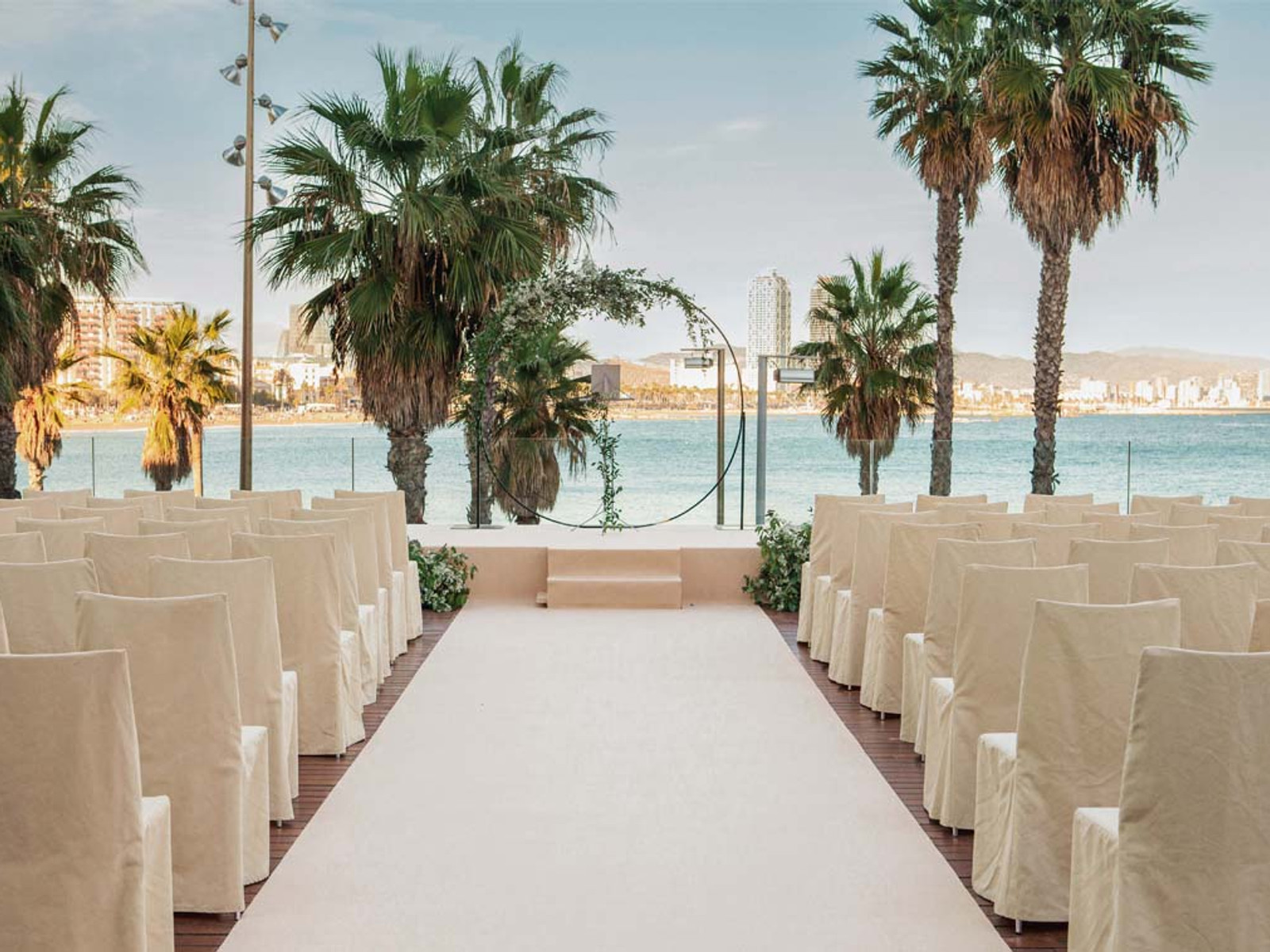 Elegant luxury wedding ceremony at W Hotel Barcelona with bride and groom