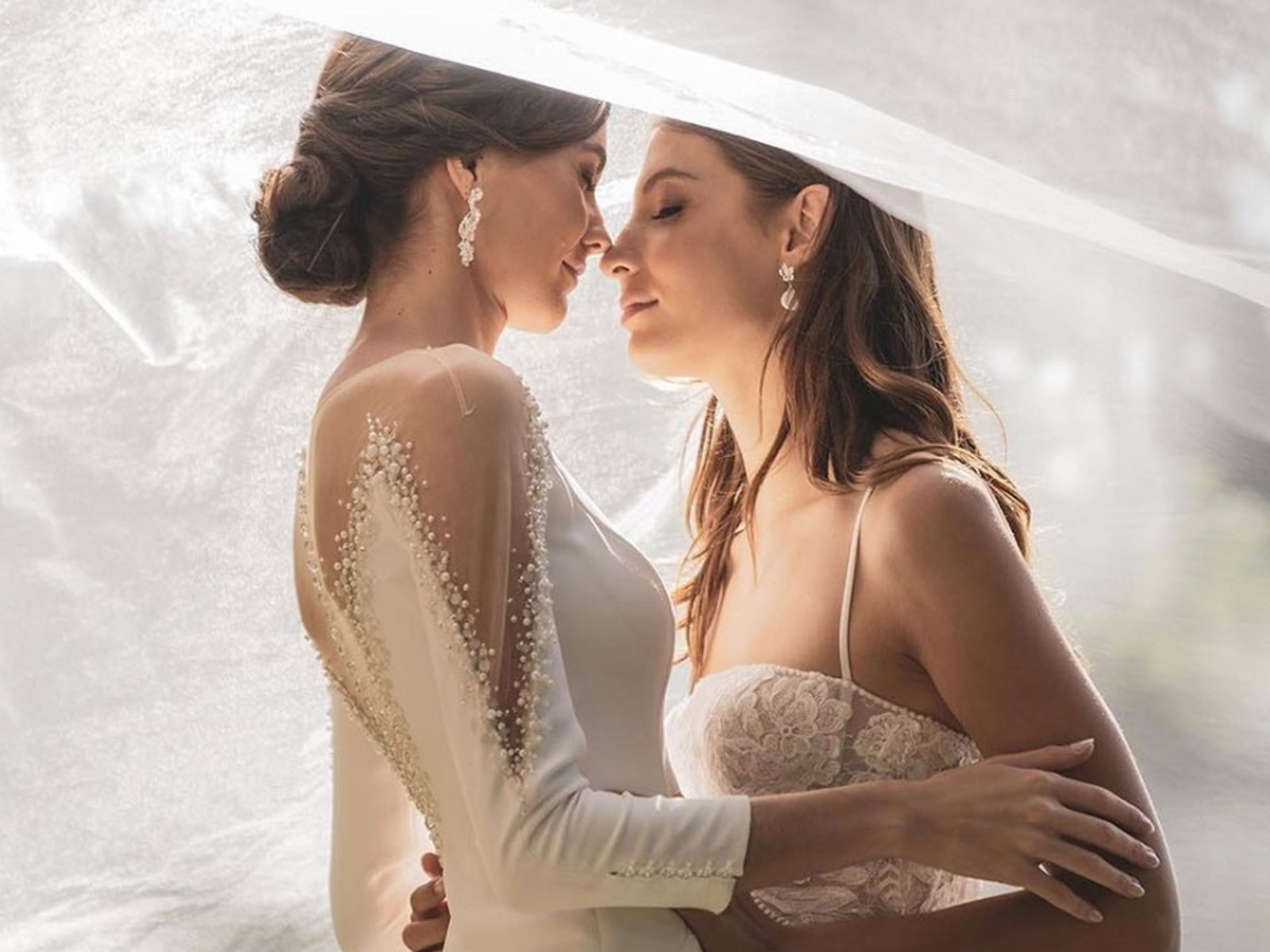 Luxury bridal boutique storefront in Barcelona showcasing elegant wedding dresses