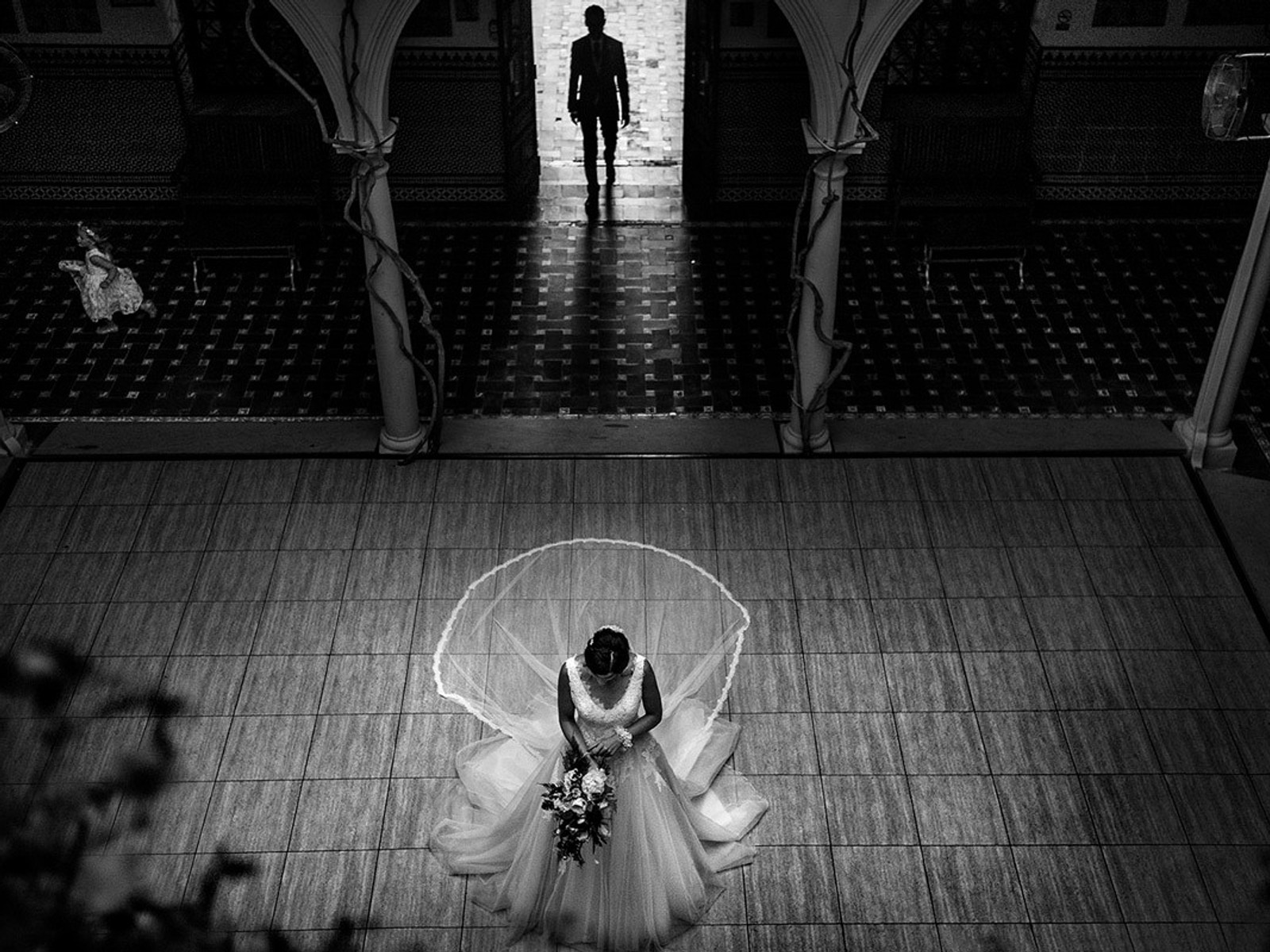 Luxury wedding photographer capturing intimate bridal moment in Barcelona ceremony