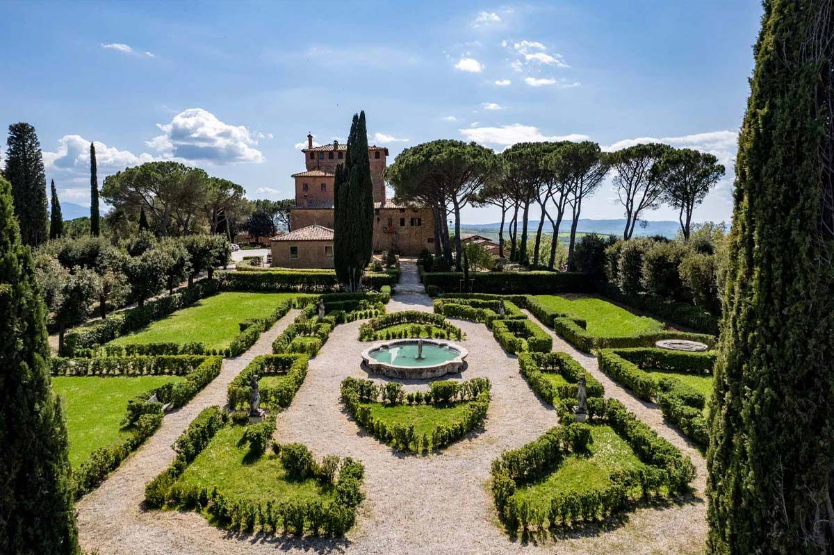 The medieval tower and formal gardens of Palazzo Massaini — destination wedding in Tuscany planned by Agape Weddings