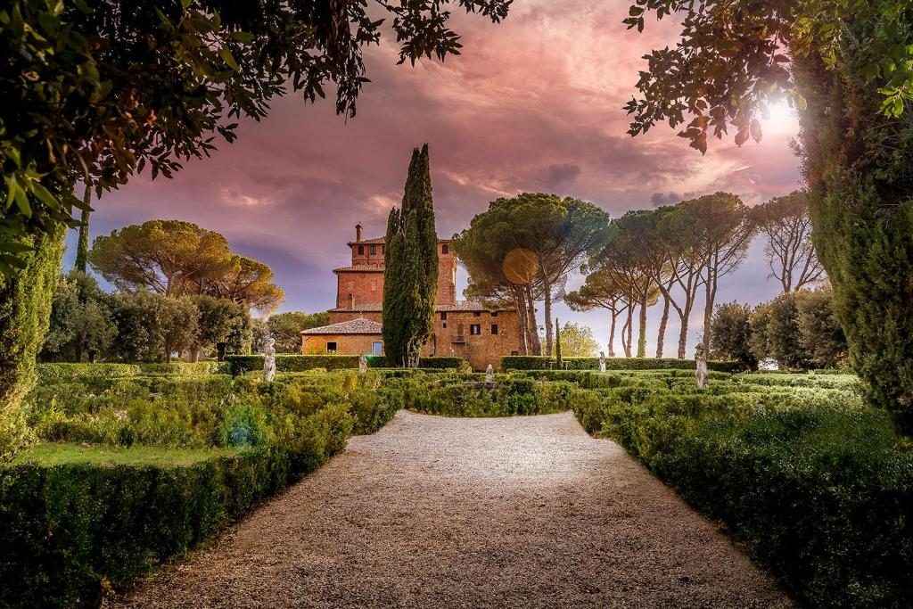 Palazzo Massaini estate at dusk over the Tuscan countryside — boutique destination wedding with Agape Weddings